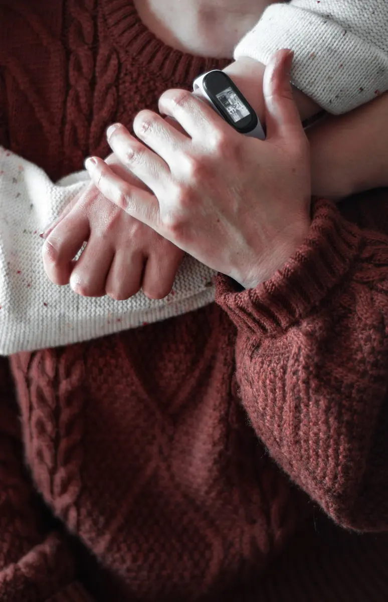 person holding black and silver device